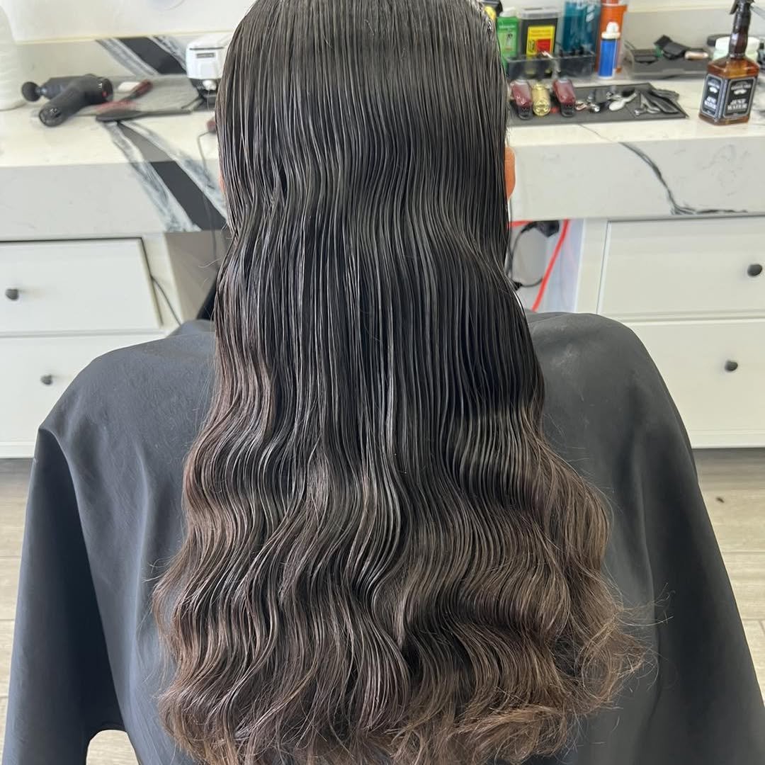 Long layered blowout styled in the shop — Blades of Gold Barbershop, Phoenix AZ