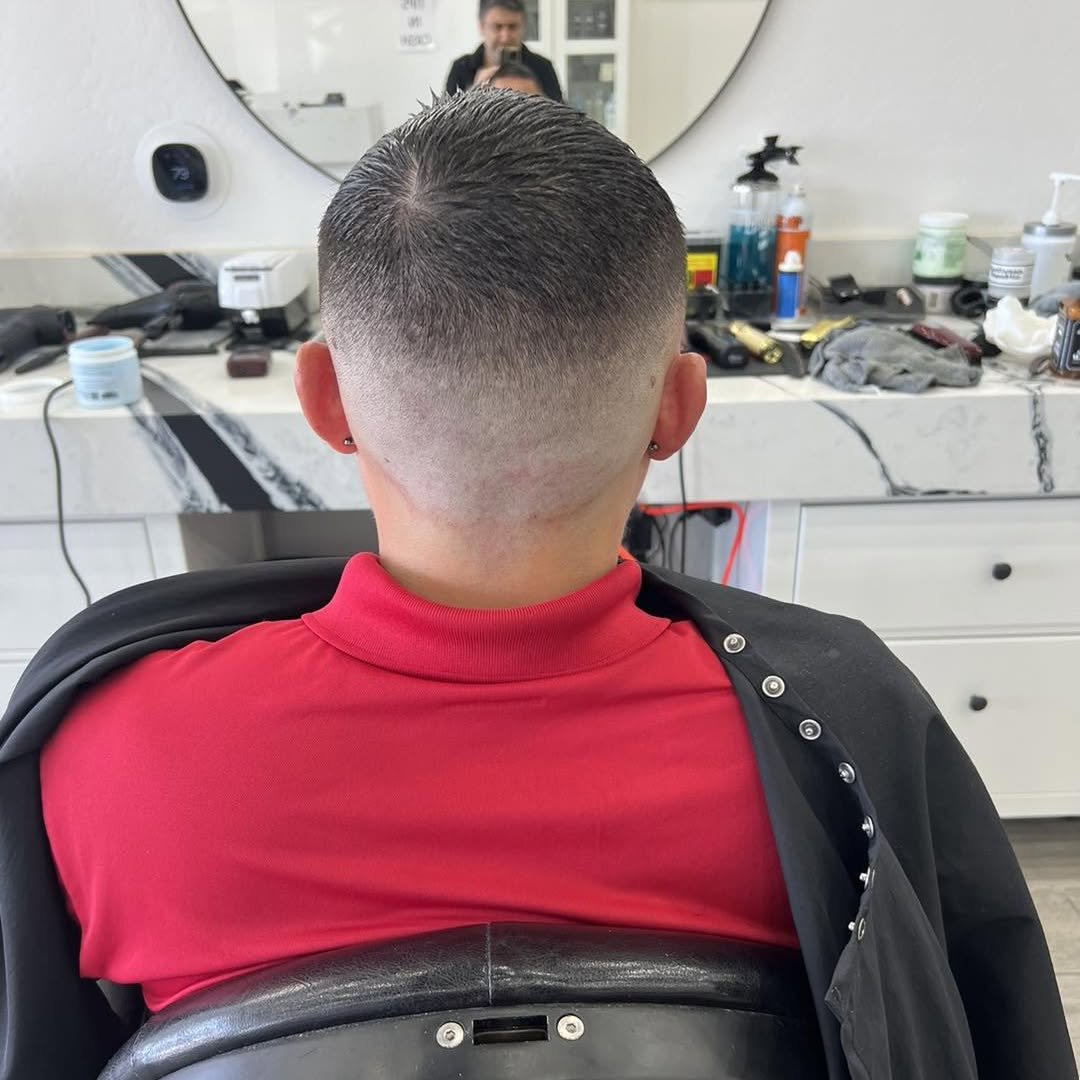 Mid fade with a sharp tapered neckline — Blades of Gold Barbershop, Phoenix AZ
