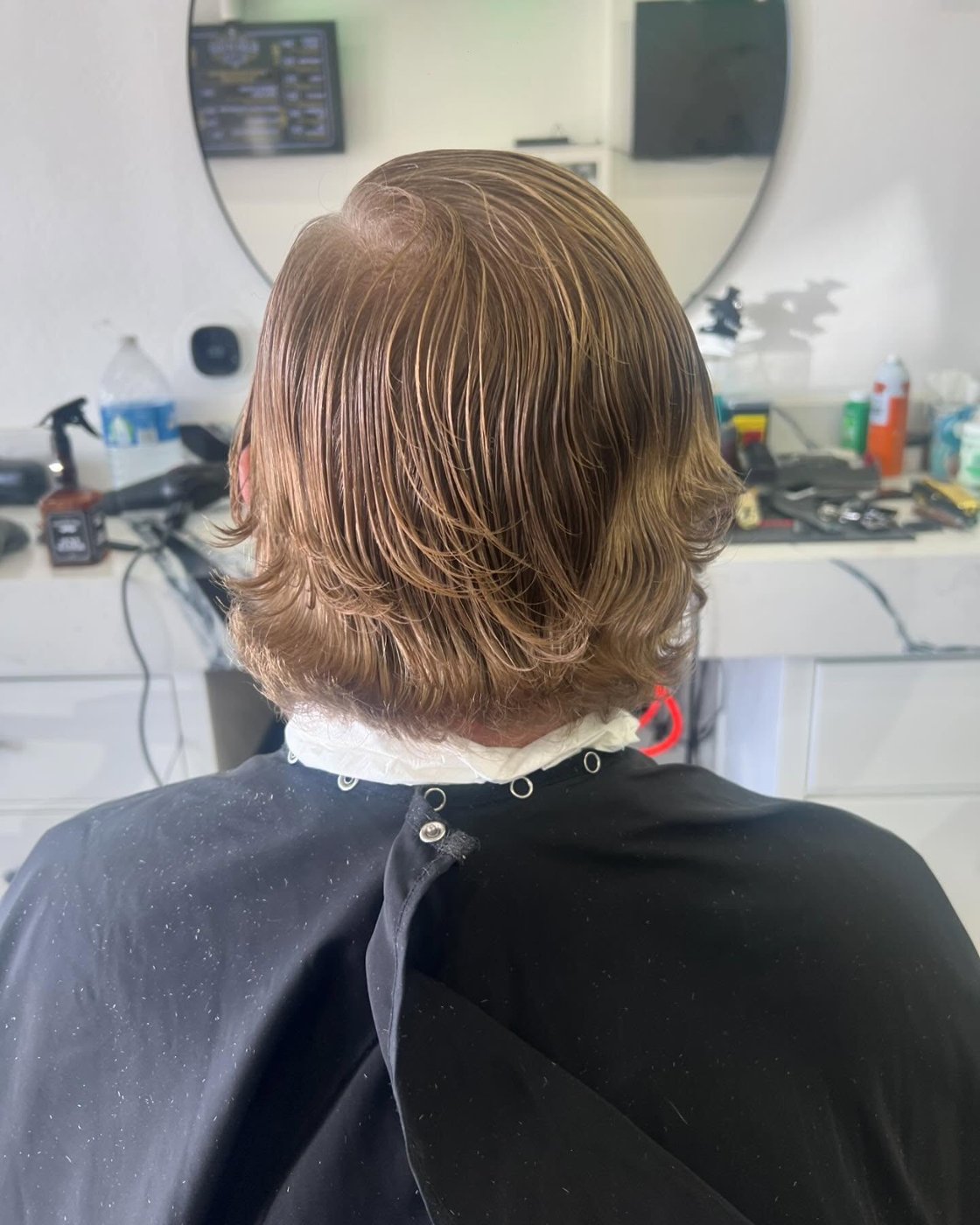 Layered mid-length cut, back view — Blades of Gold Barbershop, Phoenix AZ